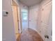 Hallway with carpet flooring features neutral walls and trim, and white doors at 403 Duncan Creek Rd # 131, Lillington, NC 27546