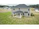 Spacious backyard featuring a covered patio and vinyl siding exterior at 590 Glenkirk Pl, Garner, NC 27529