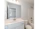 Bright bathroom featuring a single sink vanity, and toilet near tub-shower at 590 Glenkirk Pl, Garner, NC 27529