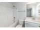 Bright bathroom featuring a shower-tub, single sink vanity, and tile floors at 590 Glenkirk Pl, Garner, NC 27529