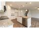 Modern kitchen with granite counters, stainless appliances, and a central island at 590 Glenkirk Pl, Garner, NC 27529