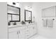 Modern bathroom featuring double vanities, framed mirrors, and ample counter space at 702 Portia Way, Homesite 16, Morrisville, NC 27560