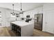 Spacious kitchen with a large island, stainless steel appliances, and ample cabinet space at 702 Portia Way, Homesite 16, Morrisville, NC 27560