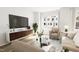 Comfortable living room with stylish furniture, a large TV, and a bright window at 702 Portia Way, Homesite 16, Morrisville, NC 27560