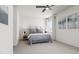 Bright main bedroom with a ceiling fan, large windows, and neutral decor at 702 Portia Way, Homesite 16, Morrisville, NC 27560