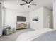 Relaxing main bedroom with a sitting area, a ceiling fan, and neutral decor at 702 Portia Way, Homesite 16, Morrisville, NC 27560
