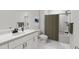 Well-lit bathroom featuring a shower-tub combo, a vanity with storage, and modern finishes at 704 Portia Way, Homesite 15, Morrisville, NC 27560