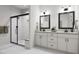 Luxurious bathroom featuring a double vanity, marble countertops, and a glass-enclosed shower at 704 Portia Way, Homesite 15, Morrisville, NC 27560