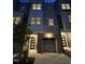 Modern townhome showcasing a two-car garage and sleek, contemporary design at 704 Portia Way, Homesite 15, Morrisville, NC 27560