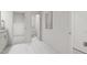 Bright hallway with white marble floors provides access to a bathroom and walk-in closet at 704 Portia Way, Homesite 15, Morrisville, NC 27560