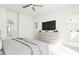 Bright main bedroom featuring a ceiling fan, ensuite bathroom, and walk-in closet at 704 Portia Way, Homesite 15, Morrisville, NC 27560
