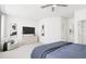 Serene main bedroom featuring a ceiling fan, media center, and an adjacent sitting area at 704 Portia Way, Homesite 15, Morrisville, NC 27560