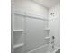 Clean bathroom showcases a white tub and shower with built in shelving and modern hardware at 1128 Middlecrest Dr, Rocky Mount, NC 27804
