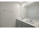 Bathroom features double sinks with modern fixtures and a large mirror for a bright and functional space at 1128 Middlecrest Dr, Rocky Mount, NC 27804