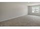 Spacious carpeted bedroom that features a window providing natural light into the living space at 1128 Middlecrest Dr, Rocky Mount, NC 27804