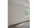 A bedroom with neutral walls, carpet flooring and a large window at 1128 Middlecrest Dr, Rocky Mount, NC 27804