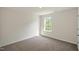 A carpeted bedroom that is bright and airy, due to the window that offers natural light at 1128 Middlecrest Dr, Rocky Mount, NC 27804