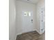 A spacious foyer with light gray wood-look floors and a white front door at 1128 Middlecrest Dr, Rocky Mount, NC 27804