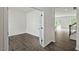 A spacious living room with light gray wood-look floors and plenty of natural light at 1128 Middlecrest Dr, Rocky Mount, NC 27804