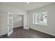 A spacious living room with light gray wood-look floors and plenty of natural light at 1128 Middlecrest Dr, Rocky Mount, NC 27804