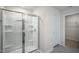 Bathroom featuring a stand-up shower with clear glass doors and multiple built-in storage shelves at 1128 Middlecrest Dr, Rocky Mount, NC 27804