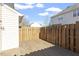 Backyard patio with a privacy fence and a well-maintained lawn at 2248 Ventana Ln, Raleigh, NC 27604