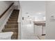 Entry leading into a well lit living room featuring fireplace, marble floors, and ceiling fan at 2248 Ventana Ln, Raleigh, NC 27604