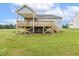 Backyard view showcasing the home's deck and outdoor living space at 261 Kissington Way, Benson, NC 27504
