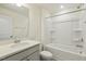 Bright bathroom with modern vanity, shower over tub, and updated fixtures at 261 Kissington Way, Benson, NC 27504