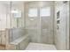 Modern bathroom featuring a glass enclosed shower with built-in bench and tile surround at 261 Kissington Way, Benson, NC 27504