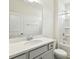 Clean, white bathroom featuring a large mirror and shower/tub combo at 261 Kissington Way, Benson, NC 27504