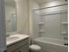 Bathroom featuring a bathtub, shower, and modern vanity with a granite counter at 261 Kissington Way, Benson, NC 27504