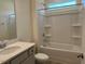 Clean bathroom features a white tub with shower, updated vanity, and bright lighting at 261 Kissington Way, Benson, NC 27504