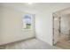 The bedroom offers neutral carpeting, a window view, and convenient access to an ensuite bathroom at 261 Kissington Way, Benson, NC 27504