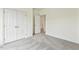 Neutral bedroom with plush carpet, closet, and white trim at 261 Kissington Way, Benson, NC 27504