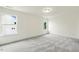 Bright bedroom features carpet, two windows, and ample natural light at 261 Kissington Way, Benson, NC 27504