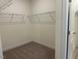 Walk-in closet with carpet and metal shelving at 261 Kissington Way, Benson, NC 27504