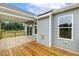 A gorgeous wooden deck with beautiful views of the lawn and trees at 261 Kissington Way, Benson, NC 27504