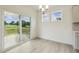 Bright dining room with wood floors and sliding glass doors to outdoor deck at 261 Kissington Way, Benson, NC 27504