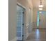 Bright and open entryway with white trim, wood-look floors, and view of the front door at 261 Kissington Way, Benson, NC 27504