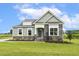 Beautiful single-Gathering home with lush green lawn and available sign at 261 Kissington Way, Benson, NC 27504
