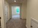 Upstairs hallway with connecting bedrooms and carpeted flooring at 261 Kissington Way, Benson, NC 27504