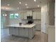 Features an island, stainless steel appliances, modern cabinets, and hardwood floors at 261 Kissington Way, Benson, NC 27504