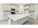 Well-equipped kitchen with a large island, white cabinets, quartz counters, and stainless steel appliances at 261 Kissington Way, Benson, NC 27504