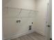 Small laundry room with standard connections and shelving at 261 Kissington Way, Benson, NC 27504