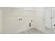 Functional laundry room with white walls, storage solutions, and clean design at 261 Kissington Way, Benson, NC 27504