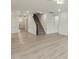 Bright living room with wood floors and staircase to second floor at 261 Kissington Way, Benson, NC 27504