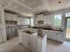 Kitchen under construction features white cabinetry, an island frame, and a window with a view to the outside at 303 Chesapeake Cmns St # 99, Garner, NC 27529