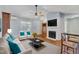 Cozy living room featuring hardwood floors, fireplace, ceiling fan, and comfortable seating at 308 Deep Creek Dr, Clayton, NC 27520