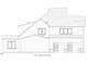 Side view detailing garage, windows, and varied siding, emphasizing clean architectural lines at 3705 Joyful Creek Trl, Zebulon, NC 27597
